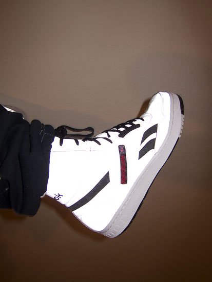 kicking pair of trainers